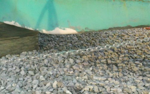 Repair from the Hangdog reef incident -- a little epoxy and a lick of paint was all it took since all that really hit was the tip of the cast iron keel.