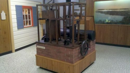 Replica of the ice machine of 1855.  Not exactly a Sub Zero, but you can see the essential pieces -- compressor, tank for refrigerant, teensy wooden box for the ice,