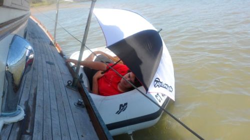 John abandons ship for a nice, level nap in the dinghy.